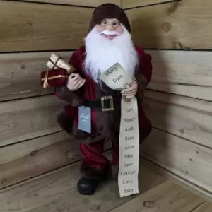 Image of Premier Decorations Ltd - 60cm Standing Santa with Glasses Holding List and Parcels In Burgundy