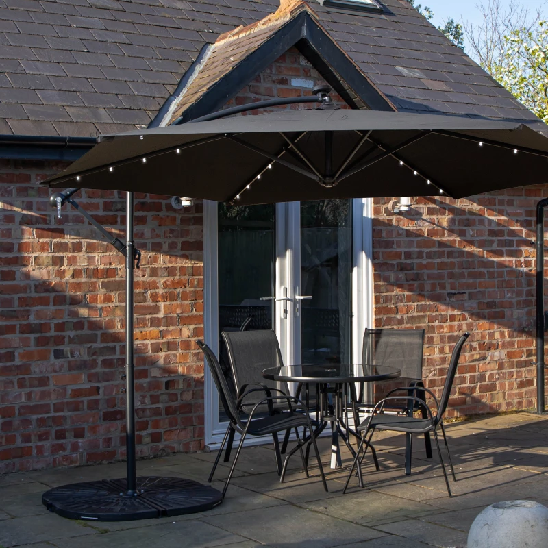 Image of Outdoor 4 Person Round Glass Top Garden Dining Table Chairs With Black Banana Lit Parasol and Base