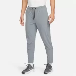 Image of Nike Dri-FIT Unlimited Mens Tapered Training Pants - Grey