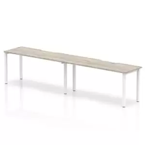 Image of Single White Frame Bench Desk 1600 Grey Oak 2 Pod