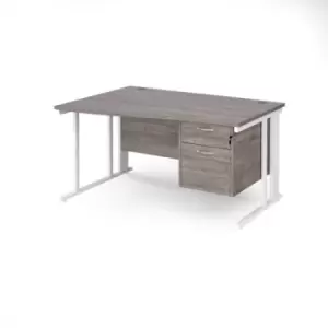 image of Maestro 25 left hand wave desk 1400mm wide with 2 drawer pedestal - white cable managed leg frame and grey oak top