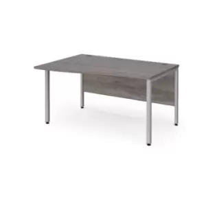 image of Maestro 25 left hand wave desk 1400mm wide - silver bench leg frame and grey oak top