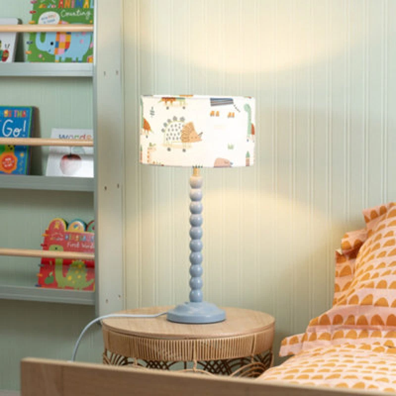 Image of ValueLights Bobbins Powder Blue Table Lamp with Cartoon Dino Drum Lamp Shade Multi