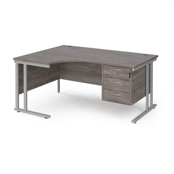 image of Maestro 25 left hand ergonomic desk 1600mm wide with 3 drawer pedestal - silver cantilever leg frame, grey oak top