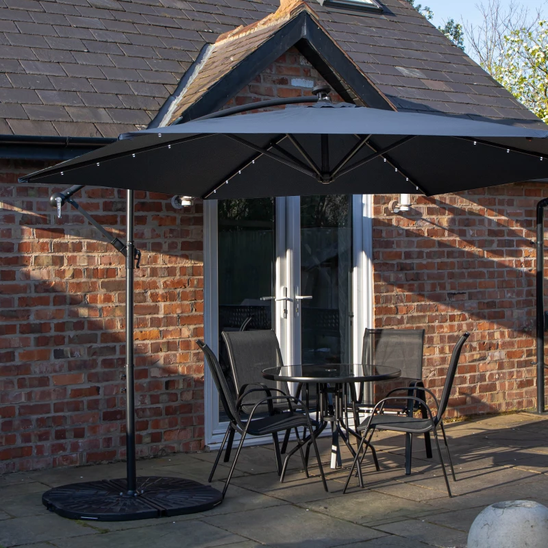 Image of Outdoor 4 Person Round Glass Top Garden Dining Table Chairs With Blue Banana Lit Parasol and Base