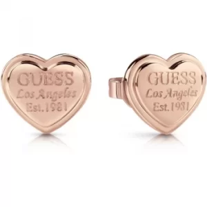 GUESS rose gold plated heart-shaped stud earrings with engraved logo.