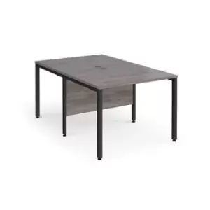 image of Maestro 25 back to back straight desks 1000mm x 1600mm - Black bench leg frame and grey oak top