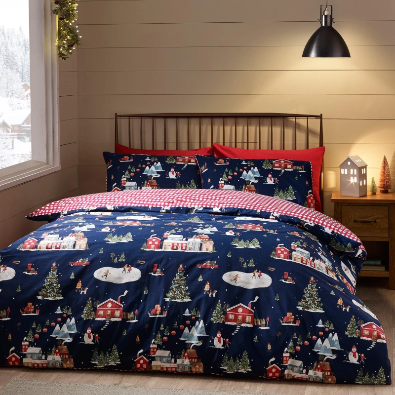 Image of Catherine Lansfield Catherine Lansfield 'Christmas Ski Village' Reversible Duvet Cover Set in Blue Size: King Blue King Unisex 5057681186504