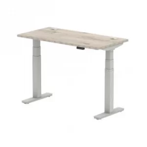 image of Air 1200 x 600mm Height Adjustable Desk Grey Oak Top Cable Ports Silver Leg