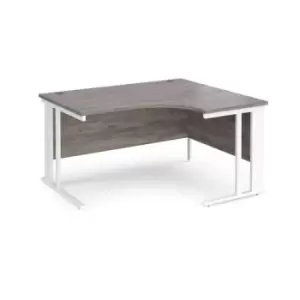 Image of Maestro 25 right hand ergonomic desk 1400mm wide - white cable managed leg frame and grey oak top