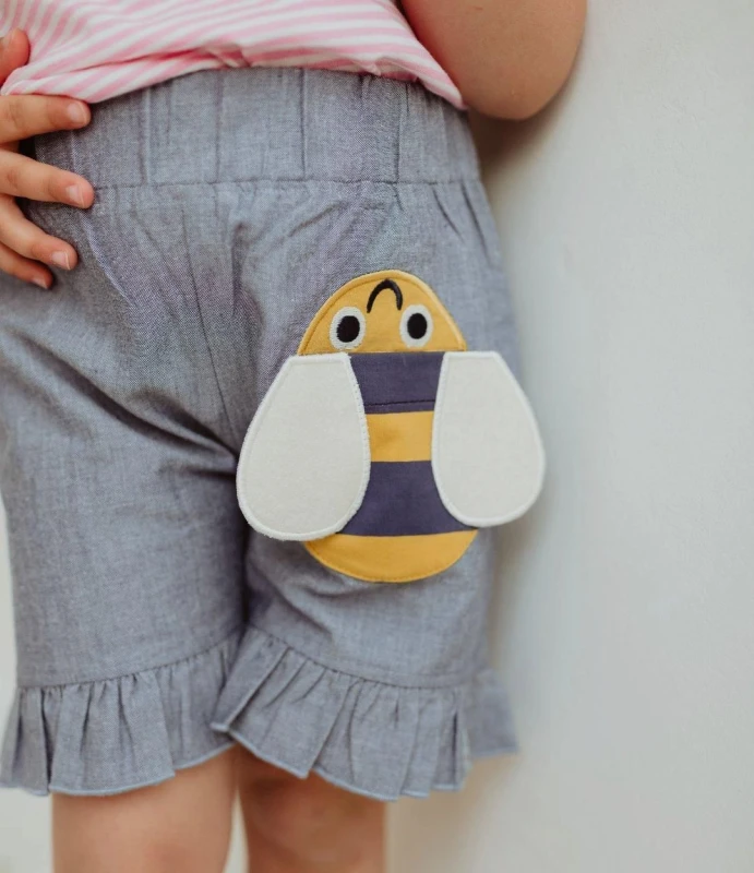 Image of Lilly + Sid Girl's Busy Bee Pocket Shorts in Blue Size: 3-4 Years Blue Female 3-4 Years