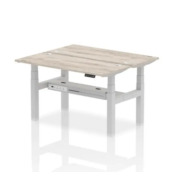 Image of Air Air Back-to-Back 1400 x 600mm Height Adjustable 2 Person Bench Desk Grey Oak Top with Cable Ports Silver Frame HASCP2P14600GRYS