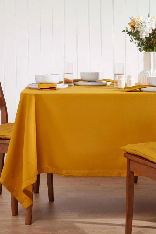 Image of Homescapes Plain Cotton Tablecloth, 137cm x 178cm Mustard