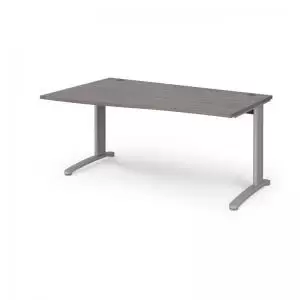 image of TR10 left hand wave desk 1600mm - silver frame and grey oak top