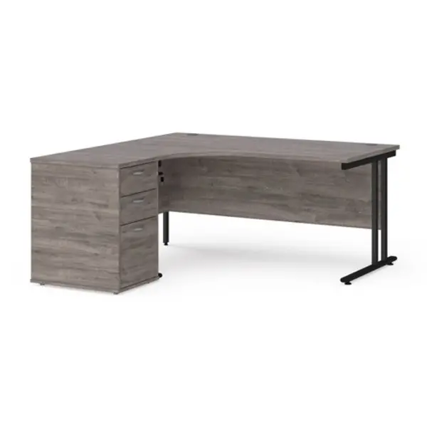 image of Maestro 25 left hand ergonomic desk 1600mm with Black cantilever frame and desk high pedestal - grey oak