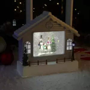 Image of The Christmas Workshop 70639 Snowman Inside A Cabin Indoor Christmas Decoration / 5 x Bright White LED Lights/Battery Operated / 26cm x 9cm x 22cm