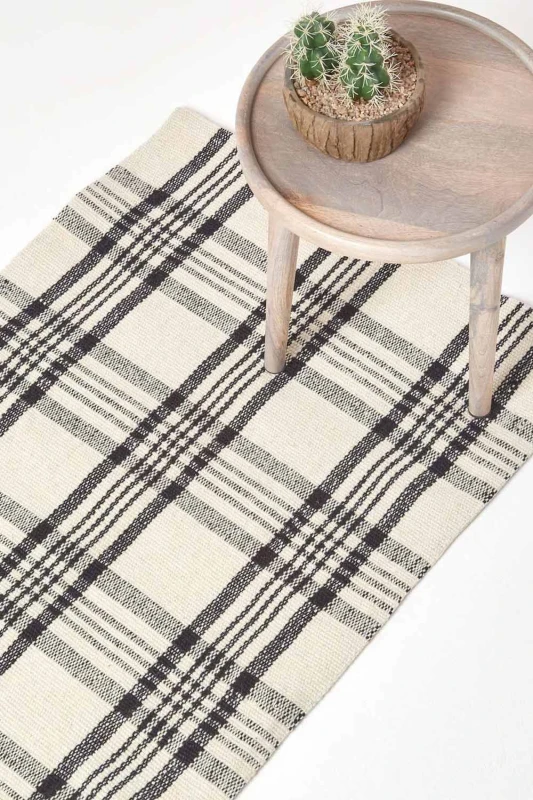Image of Homescapes Logan Black And White Tartan Check Non-Slip 100% Wool Rug, 120 X 170 Cm