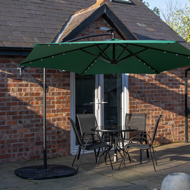 Image of Outdoor 4 Person Round Glass Top Garden Dining Table Chairs With Green Banana Lit Parasol and Base