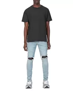 Image of Purple Brand Dropped Slim Fit Destroyed Jeans in Light Indigo
