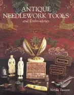 Image of antique needlework tools and embroideries