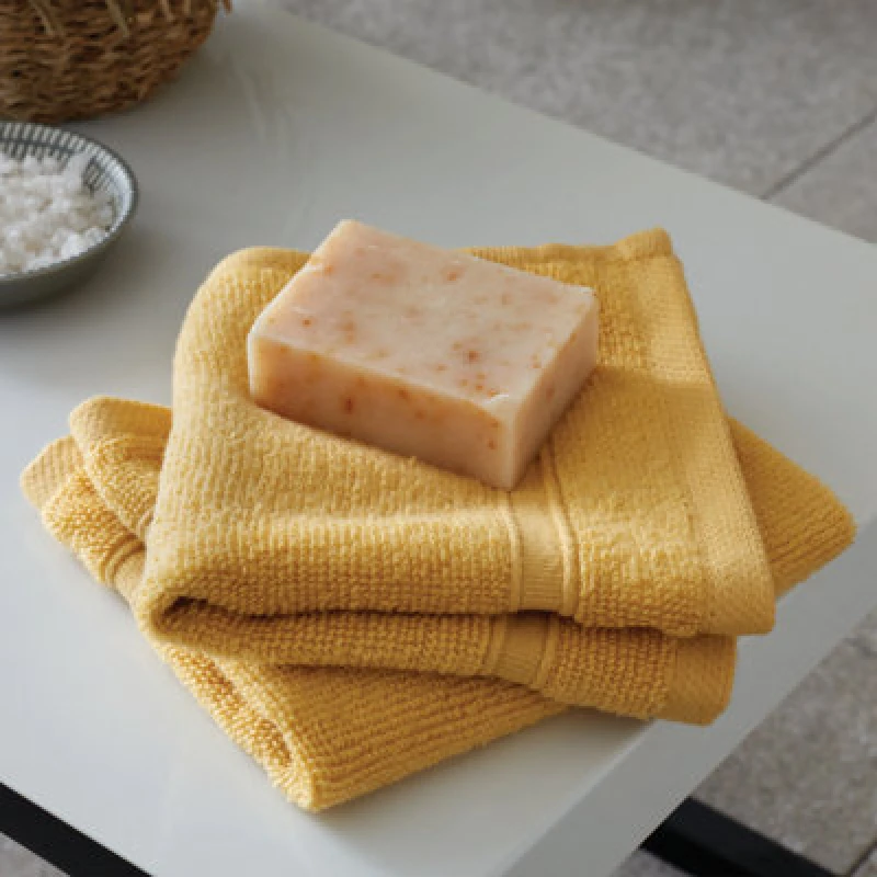Image of Catherine Lansfield Catherine Lansfield 'Zero Twist' Face Cloth Pair in Yellow Size: Face Towel Yellow Face Towel Unisex 5057681028729