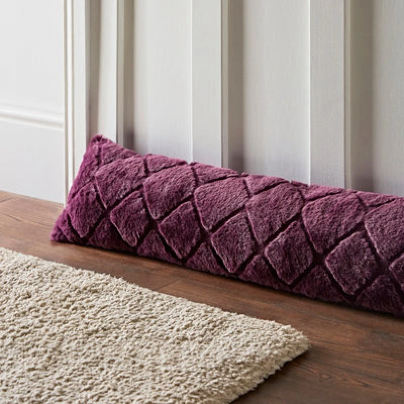 Image of Catherine Lansfield Catherine Lansfield 'Cosy Diamond' Draught Excluder in Plum Plum One Size Unisex 5057681115184