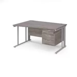 image of Maestro 25 left hand wave desk 1400mm wide with 3 drawer pedestal - silver cable managed leg frame and grey oak top