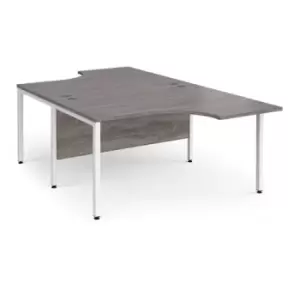 image of Maestro 25 back to back ergonomic desks 1400mm deep - white bench leg frame and grey oak top