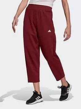 Image of adidas Designed To Move Studio 7/8 Sport Joggers, Red Size M Women