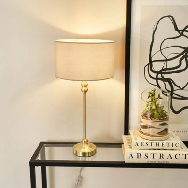 Image of ValueLights ValueLights Maggie Gold Metal Candlestick Slim Table Lamp with Fabric Drum Lamp Shade in Natural Natural One Size Unisex 5059406046094