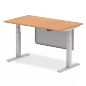 Image of Air 1400 x 800mm Height Adjustable Desk Oak Top Silver Leg With Silver Steel Modesty Panel