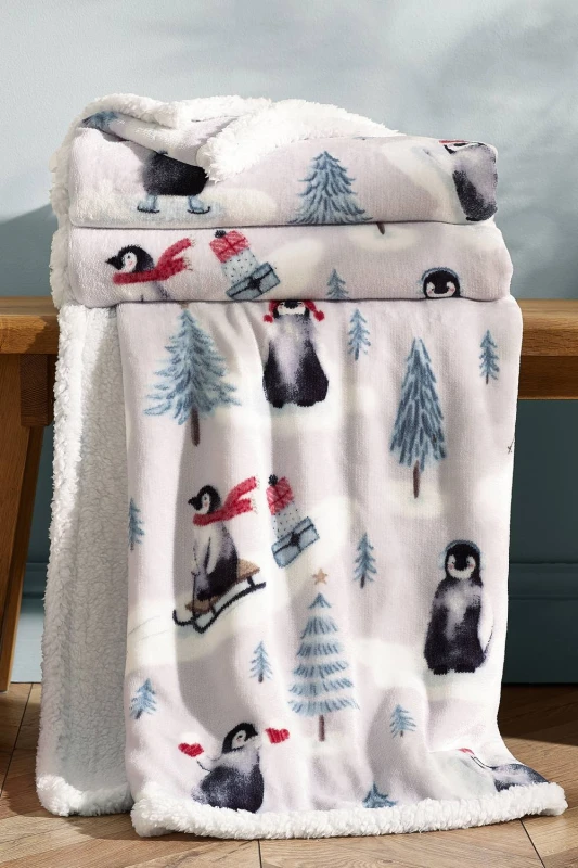 Image of Catherine Lansfield 'Christmas Sherpa Penguins' Cosy Blanket Throw in Natural Size: 130cm x 170cm Natural Unisex 130cm x 170 cm