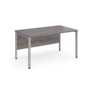 image of Maestro 25 straight desk 1400mm x 800mm - silver bench leg frame and grey oak top