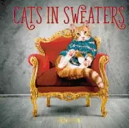Image of cats in sweaters