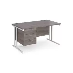 Image of Maestro 25 straight desk 1400mm x 800mm with 3 drawer pedestal - white cantilever leg frame and grey oak top