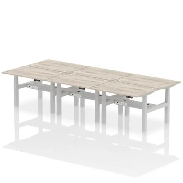 Image of Air Air Back-to-Back 1200 x 800mm Height Adjustable 6 Person Bench Desk Grey Oak Top with Cable Ports Silver Frame HASCP6P12800GRYS