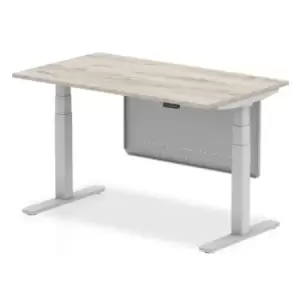 Image of Air 1400 x 800mm Height Adjustable Desk Grey Oak Top Silver Leg With Silver Steel Modesty Panel