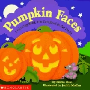 Image of pumpkin faces a glowing book you can read in the dark
