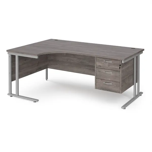 image of Maestro 25 left hand ergonomic desk 1800mm wide with 3 drawer pedestal - silver cantilever leg frame, grey oak top