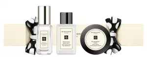 image of Jo Malone London Christmas Cracker 9ml Honeysuckle & Davana Cologne + 15ml English Pear & Freesia Hand & Body Wash + Peony & Blush Suede Body Cream