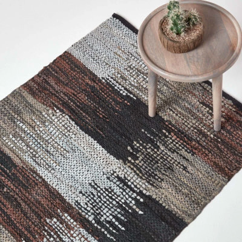 Image of Homescapes Black, Grey & Brown Real Leather Handwoven Cutshuttle Rug, 120 X 240 Cm