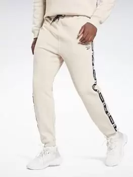 Image of Reebok Training Essentials Tape Joggers, Beige Size M Men