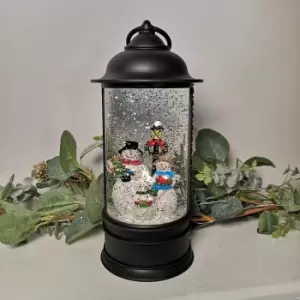 image of 29cm Snowtime Christmas Water Spinner Antique Effect Lantern With A Snowman Family Dual Power