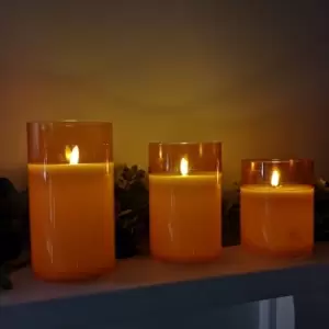 image of Decoris - Set of 3 Warm White Battery Operated Christmas Wax Candles with Timer in Peach Glass