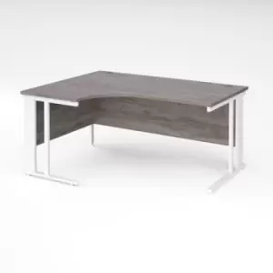 Image of Maestro 25 left hand ergonomic desk 1600mm wide - white cable managed leg frame and grey oak top