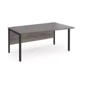 image of Maestro 25 right hand wave desk 1600mm wide - Black bench leg frame and grey oak top