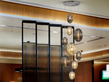 image of Ovila Modern Cluster Drop 9 Light LED Pendant Light, Oval Cognac & Smoke Grey Shades