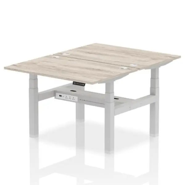 Image of Air Air Back-to-Back 1200 x 800mm Height Adjustable 2 Person Bench Desk Grey Oak Top with Cable Ports Silver Frame HASCP2P12800GRYS