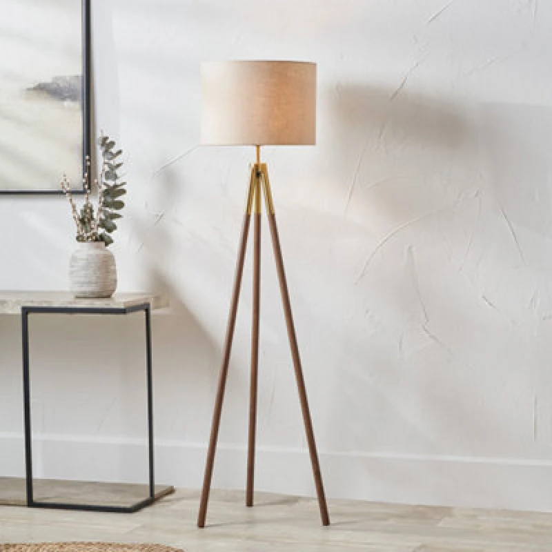 Image of Pacific Lifestyle Gold Metal And Wood Grain Tripod Floor Lamp