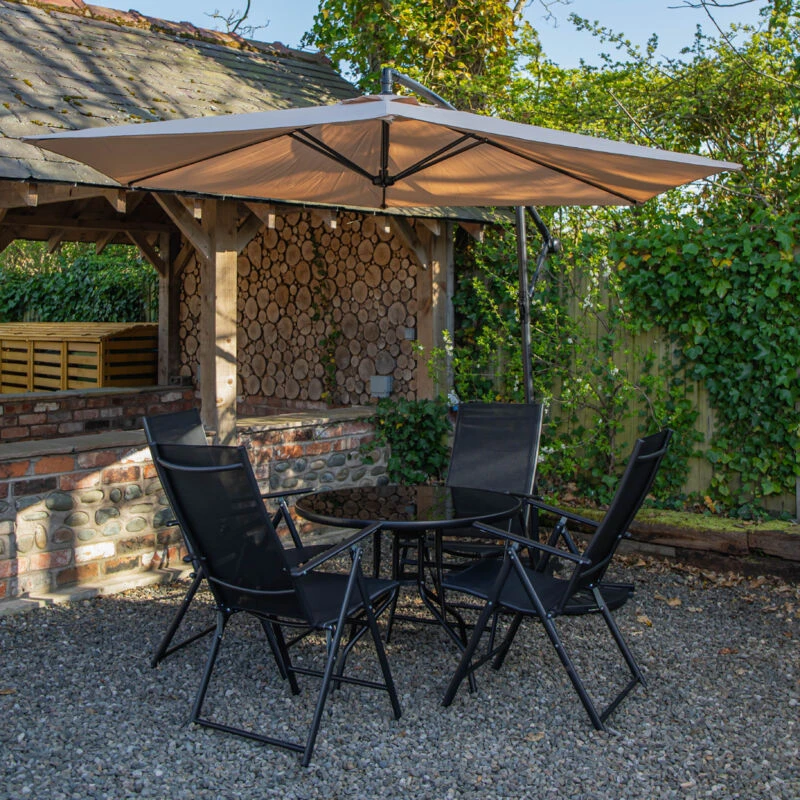 Image of Samuel Alexander Outdoor 4 Person Round Glass Top Garden Dining Table Chairs With Banana Parasol & Base in Beige Beige Unisex 4 Person